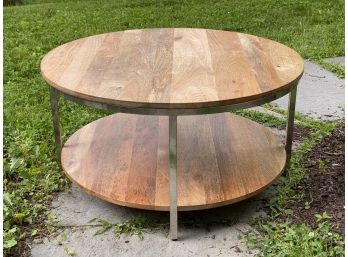 A Modern Round, Wooden Coffee Table With A Chrome Frame & Lower Shelf