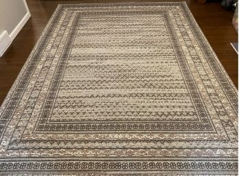 An Attractive Woven Area Rug In Neutral Earth Tones