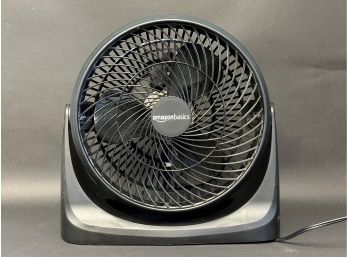 An Amazon Basics Air-Circulator Floor Fan