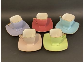 A Fun Set Of Five Brightly Colored Cups & Saucers