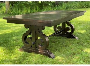A Substantial Trestle Table With A Distressed Plank Top