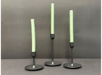 Three Modern Candlesticks In Black Metal