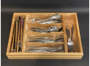 An Assortment Of Stainless Flatware & Chopsticks In A Wooden Organizer