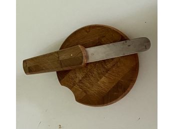 A Vintage Wooden Cheese Board With Hidden Knife