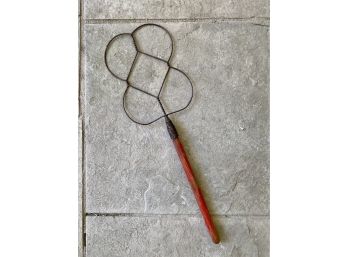 An Antique Rug And Blanket Beater