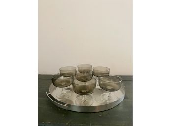 A Set Of 7 Vintage Smoky Gray Mid Century Coupe Glasses On Chrome Bar Tray