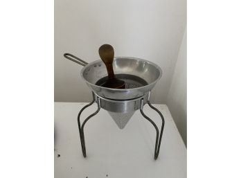 A Vintage Cone-shaped Chinois Sieve Strainer On Stand With Wooden Press