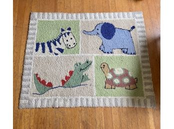 A Whimsical Hooked Scatter Rug With Animal Motif