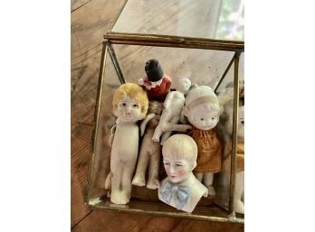 A Collection Of Porcelain Kewpie Dolls