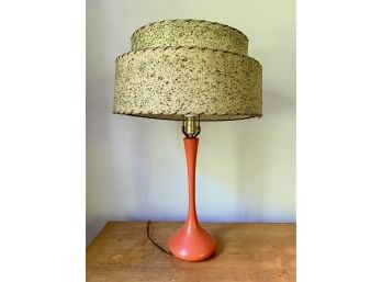 A Mid-Century Modern Orange Table Lamp With VE