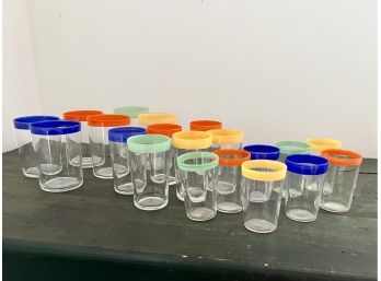 A Set Of Vintage Glass Tumblers With Colorful Rims