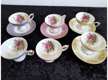 Pinks And Yellow Tea Cups And Saucers