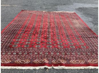 Large Red Rug With Blue, Tan, And Whites