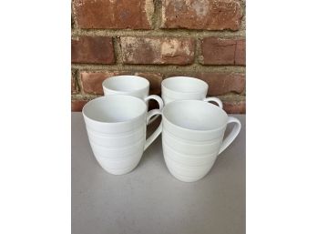 A Set Of 4 White Coffee Mugs