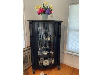 A Vintage Black China Cabinet With Glass Door