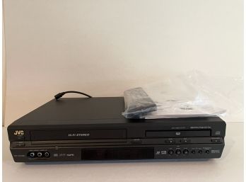 A JVC DVD Player With Remote And Manual