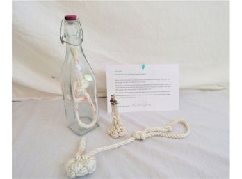 Knotted Rope In Bottle With Paperwork