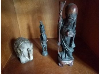 SHELF LOT: 3 Statues: 1 Elephant. 1 Plague Figure. 1 Bearded Figure (Lot 108)