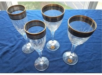 SET Of 4 Gold Rimmed Noritake Crystal Drinkware: 2 Champagne Flutes And 2 Wine Glasses  (Lot 162)