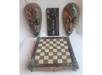 Tribal Decor Lot: 2 Painted Masks. Wooden Abacus And Chess / Checkers Board With Feet (Lot 034)