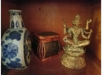 SHELF LOT: 3-pieces Of Decor: Armed Figurine. Rattan Box With Handle. Blue White China Vase (Lot 110)