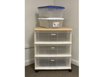 A Rolling Storage Cart With A Wood Top & Three Drawers