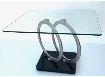 Modern Glass Coffee Table  With Thick Tempered Glass Top Set On Brushed Metal Rings On Black Base