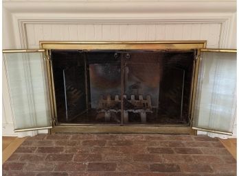 A Gold Tone Fireplace Glass Screen