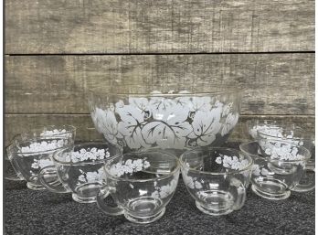 A Vintage Glass Bowl With 8 Cups, Gold Toned Rim And White Leaf Design