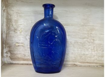 A Vintage Blue Glass Bottle
