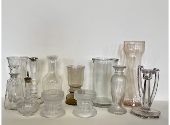 A Large Collection Of Glass Vases, Candle Sticks And More