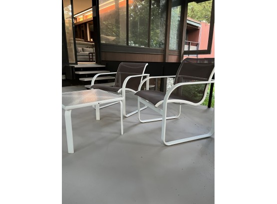 A Pair Of Brown Jordon Quantum Aluminum Frame And Sling Chairs With Cocktail Table