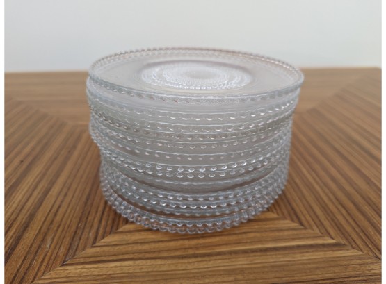A Set Of 14 Glass Salad Plates With Beaded Edge