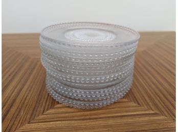 A Set Of 14 Glass Salad Plates With Beaded Edge