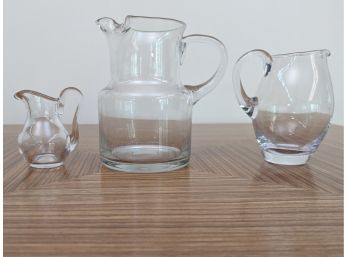 A Set Of 3 Assorted Glass Pitchers - Including Baccarat