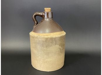 A Vintage Whiskey Jug With Cork