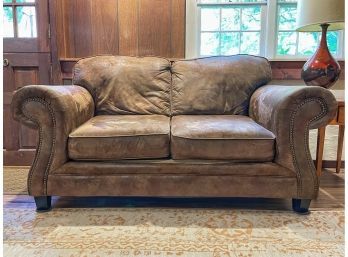 Naugahyde Loveseat With Rolled Arms