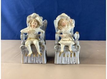 Boy And Girl Sitting In Chairs Figurines