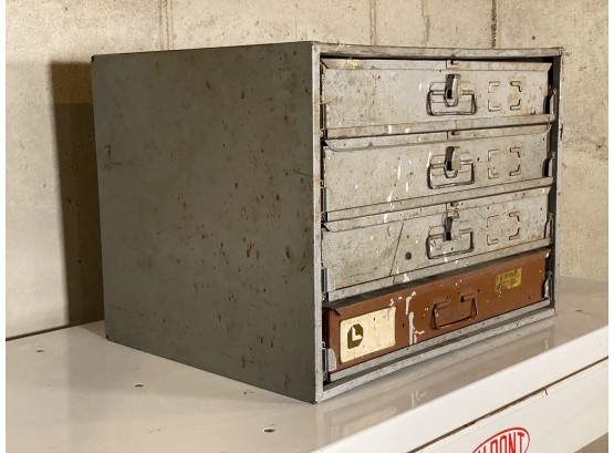 A Vintage Cabinet With Covered Case Drawers