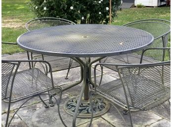 A Classic Metal Outdoor Dining Table & Four Chairs