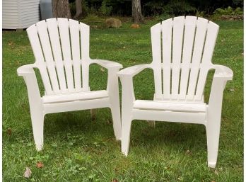 A Pair Of Classic Adirondack Chairs In Molded Plastic