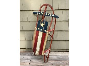 A Vintage Wooden Sled With A Stars & Stripes Motif