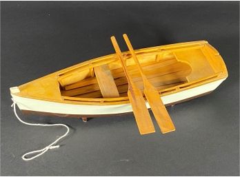 A Charming Little Wooden Rowboat Model