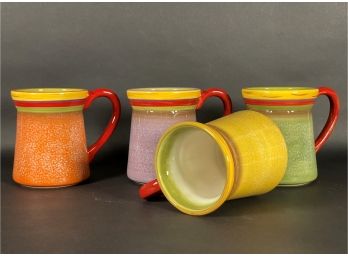 A Set Of Four Coordinated Ceramic Mugs