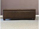 A Button-Tufted Storage Bench With A Hinged Lid