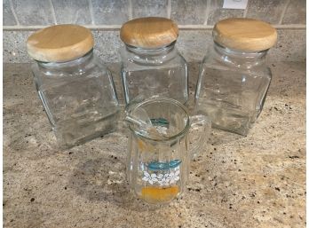 3 Glass Canisters And Vintage Orange Juice Pitcher