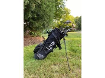 Mixed Set Of Golf Clubs In LYNX Bag With Contents