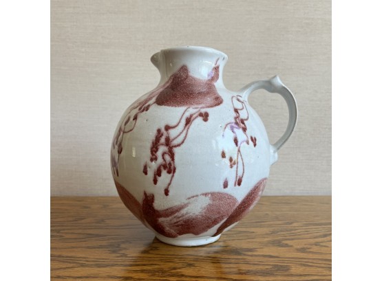 A Beautiful Hand Crafted Round Pitcher With Lovely Rosey Glaze On White - Signed