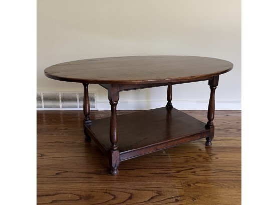 An Colonial Style Antique Reproduction Two Tier Oak Oval Coffee Table