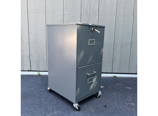 A Metal 2 Drawer Filing Cabinet On Wheels With Key